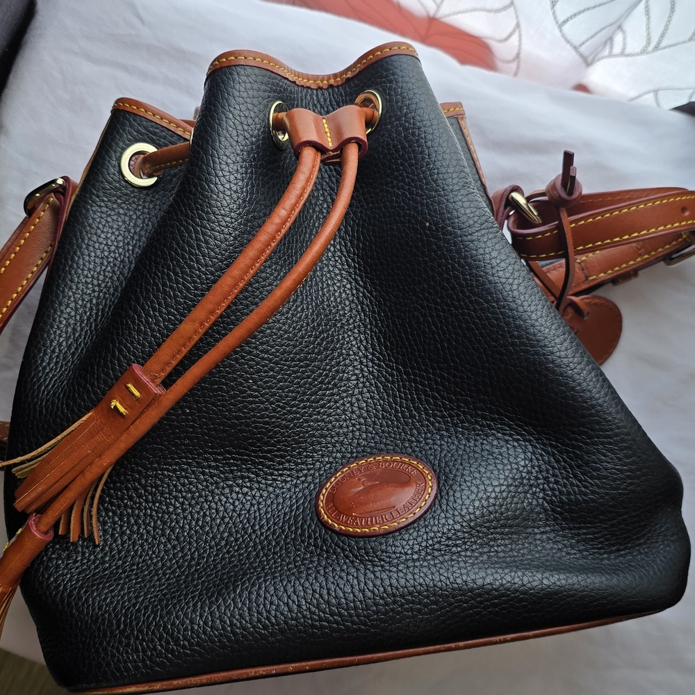 Dooney & Bourke Black and Tan Drawstring Backpack